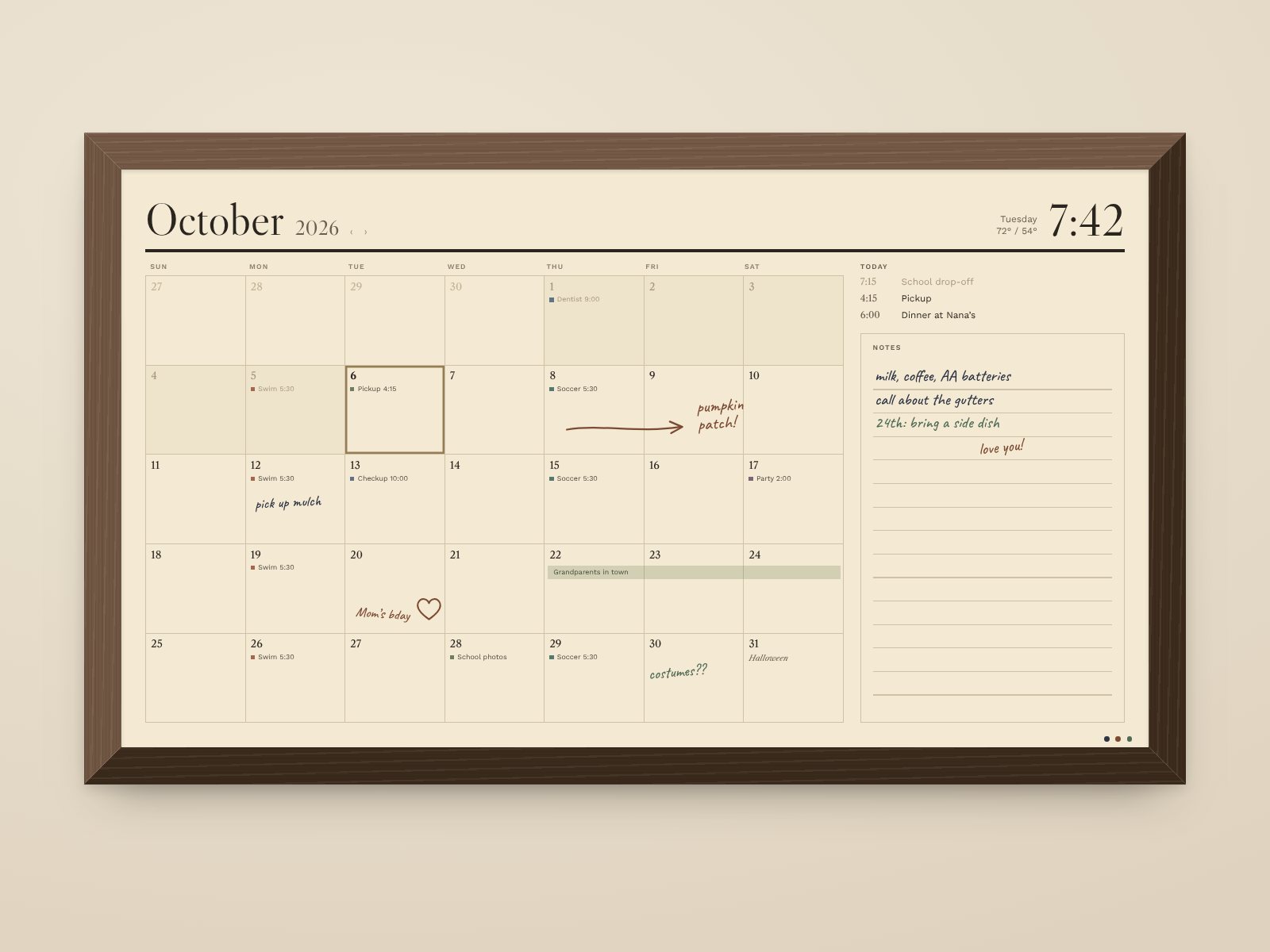 Concept render of Daybook in a walnut frame showing October: appointments in each day and handwritten notes across the month.